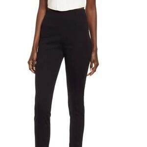 ZIP hems enhance the sleek look of flat-front pants styled w/ raised seams. NWT